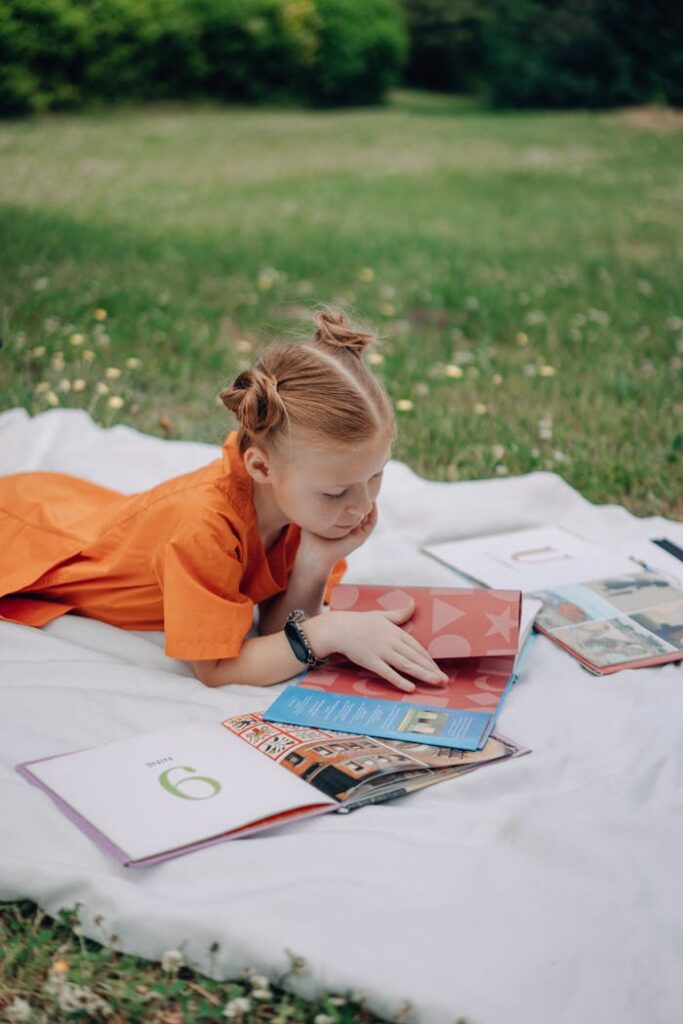 A Girl Reading Books Outdoors